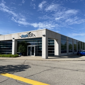 Exterior view of building at 615 Kumpf Drive with a part of the parking lot showing