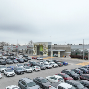 1400 Victoria Street E building exterior showing main entrance and parking