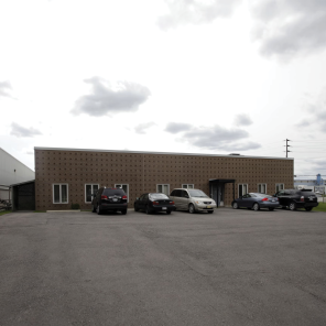 96 Armstrong Avenue building exterior with main entrance and parking