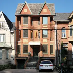 Photo of 3 story office building with red brick