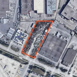 Google Earth Aerial of Land Parcel outlined in orange with trailers stored on the parcel 