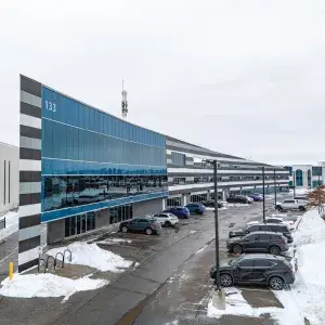 133 Milani Boulevard building exterior showing parking lot