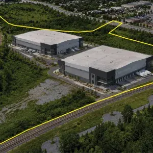 Aerial View of 2670 Walkley Road, with a yellow property outline and renderings of two potential industrial buildings