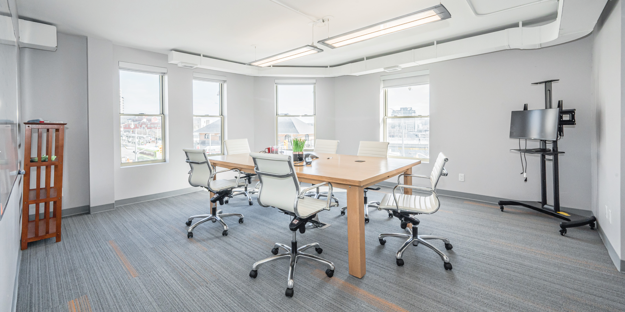 Third Floor Meeting Room with large desk and plenty of windows