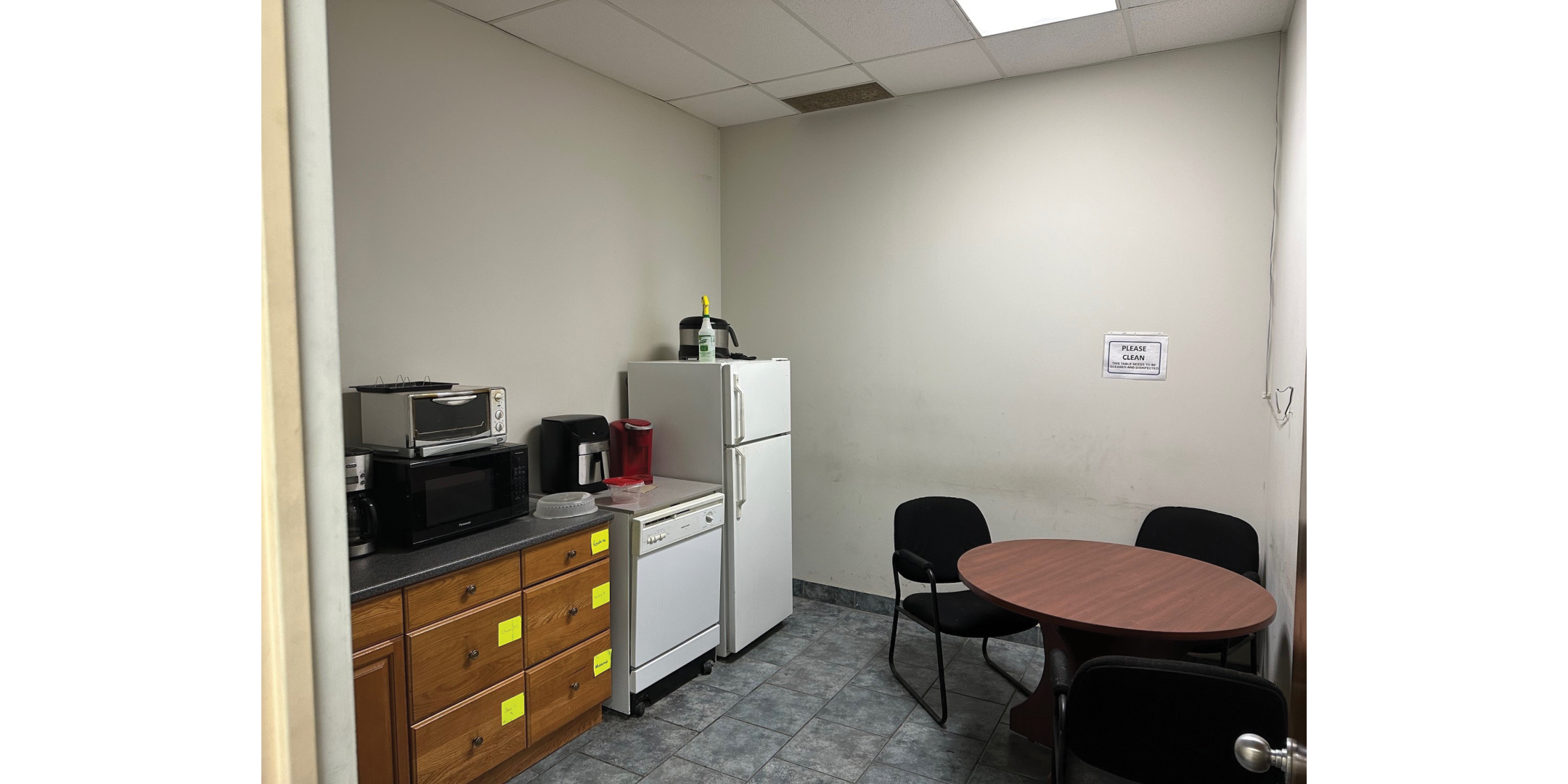 3 Paisley Lane Interior Lunchroom with fridge, table, microwave and chairs