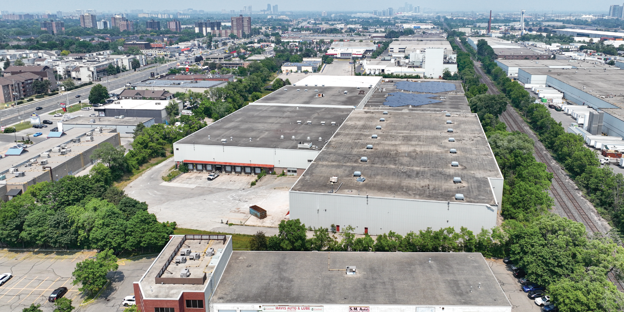 Aerial of 2550 Stanfield Road showing rear entrance, truck level doors, and railroad