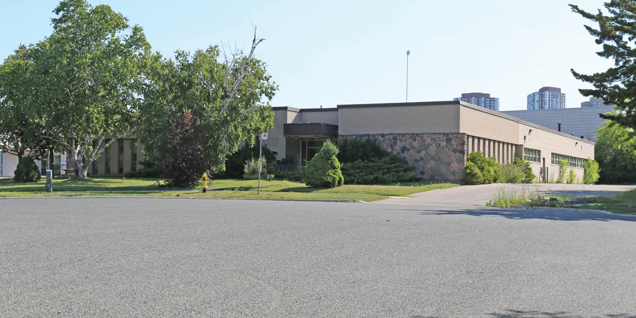 55 Gervais Drive front of Building with lots of parking
