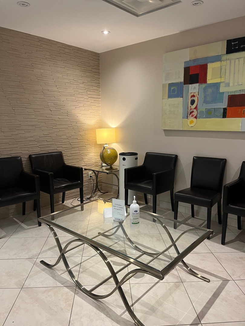 waiting area with black chairs 