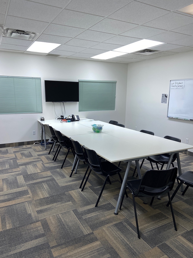 73 Mutual Street Boardroom with large desk and TV mounted on the wall