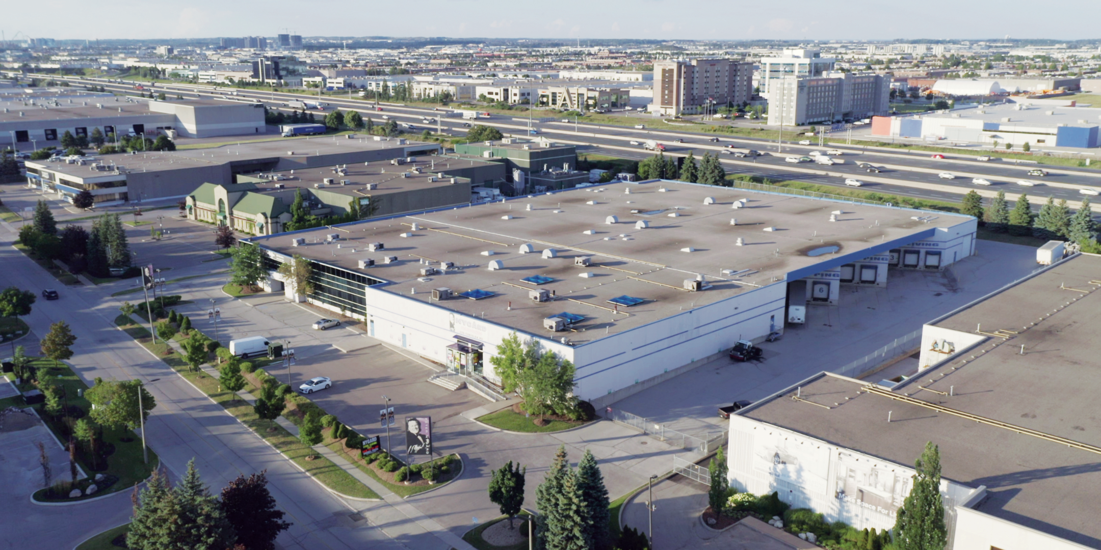 Aerial of 239 Chrislea Road with truck level doors, main entrance, and parking