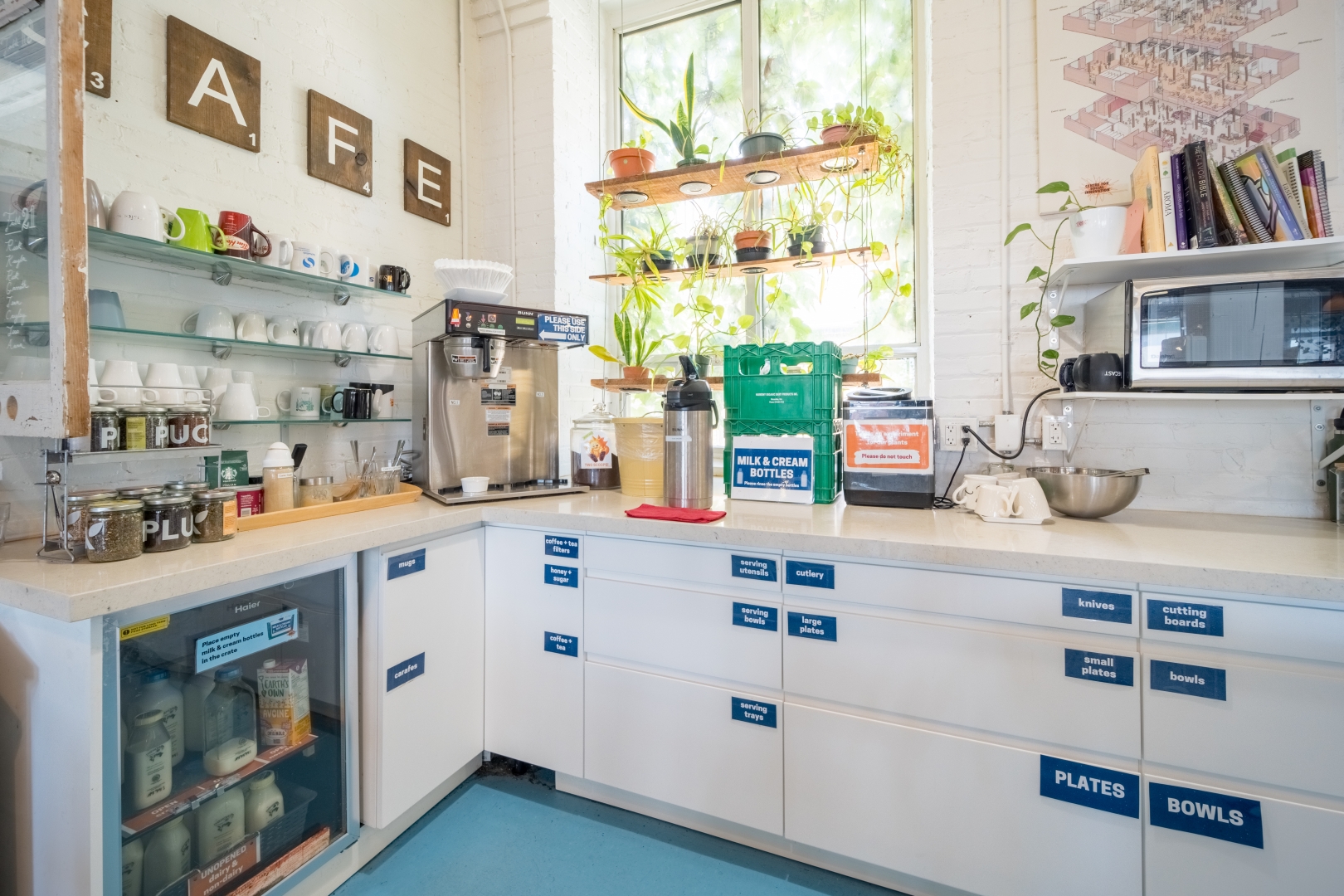720 Bathhurst St community kitchen with lots of cups