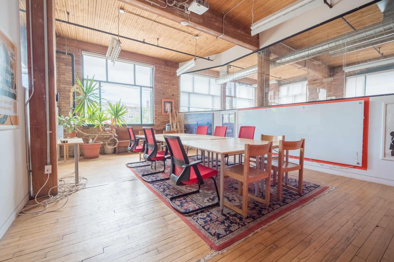 720 Bathhurst St meeting room with large desk and chairs