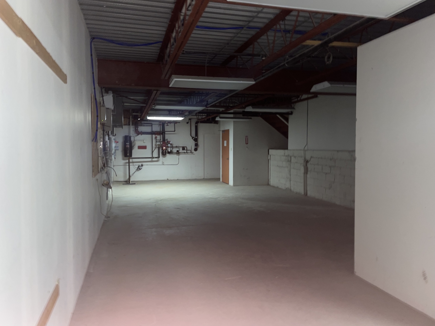 832 Eglinton Avenue interior space with pipes on the wall