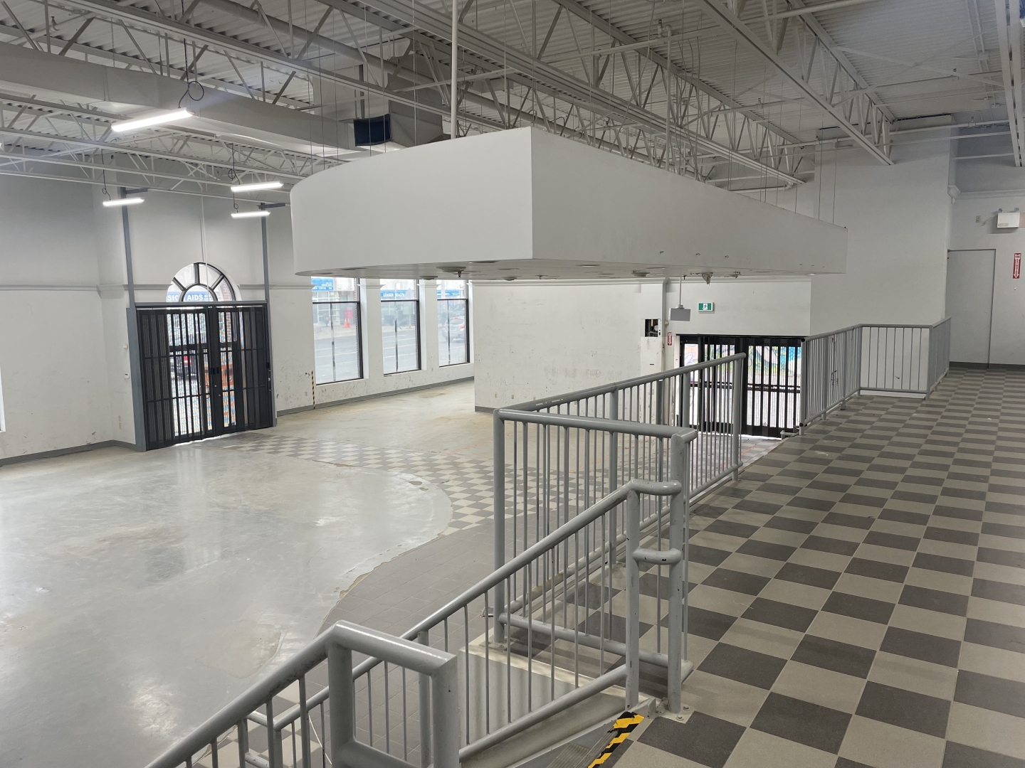 832 Eglinton Avenue vacant interior space with huge windows fronting the street