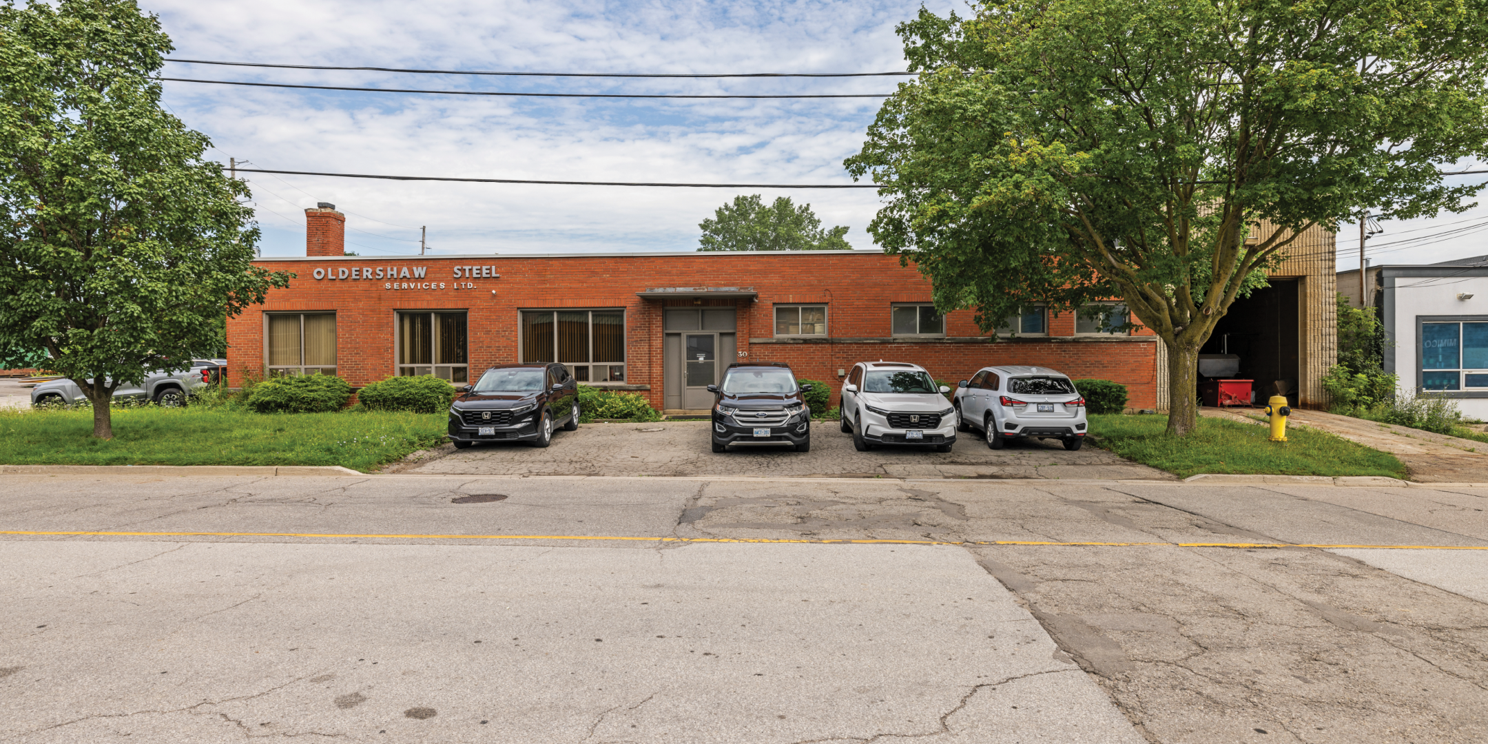 12-50 Drummond Street view of the building and parking area