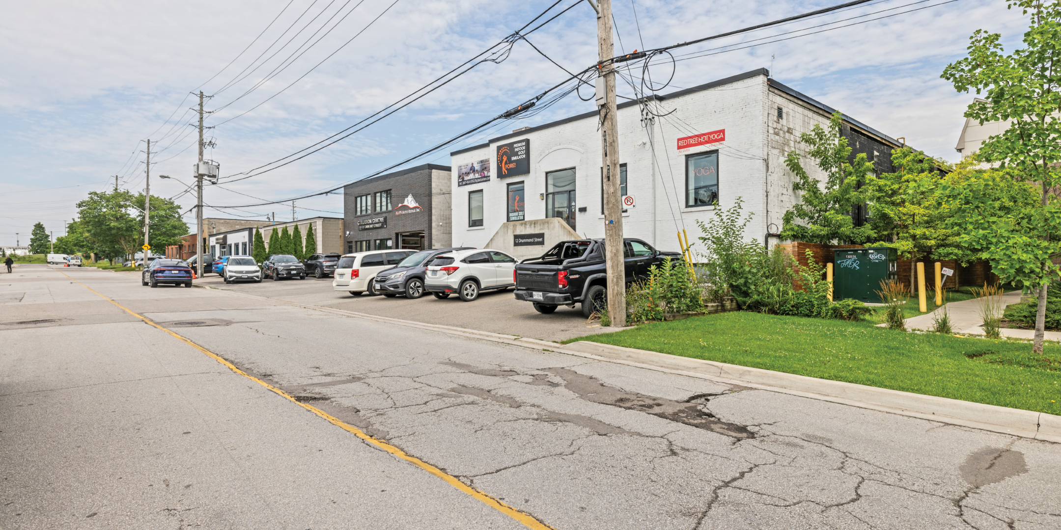12-50 Drummond Street view of the white building and parking