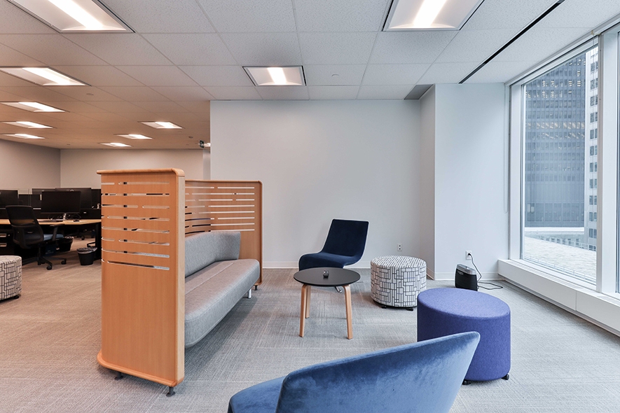 181 Bay Street Common area with sofa and stools beside the window