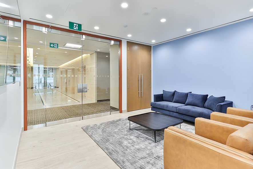181 Bay Street Reception area with glass door and sofa