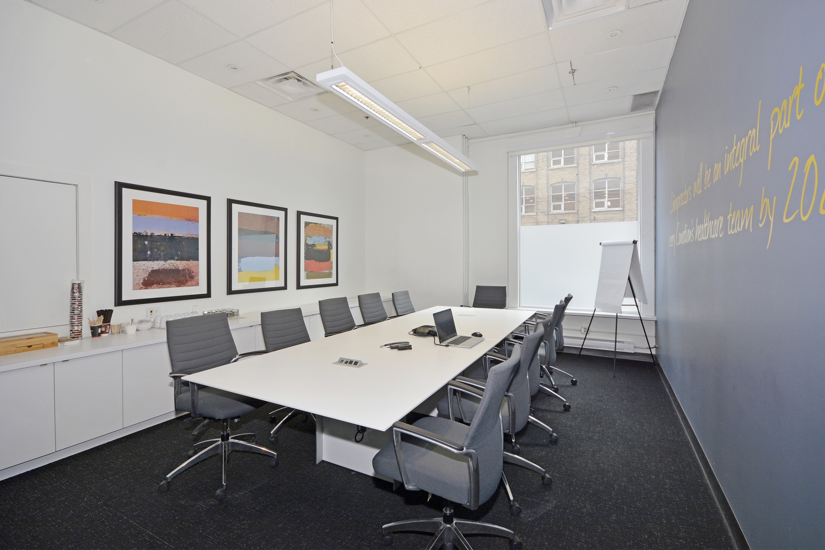 188 Spadina Avenue Boardroom with paintings and whiteboard on the wall