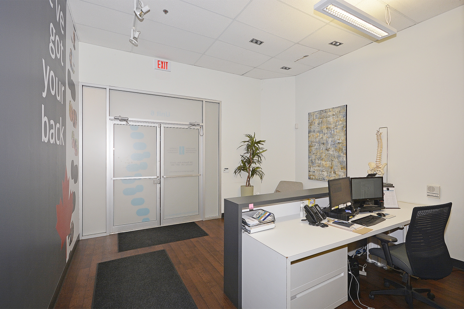 188 Spadina Avenue private office with paintings and plants