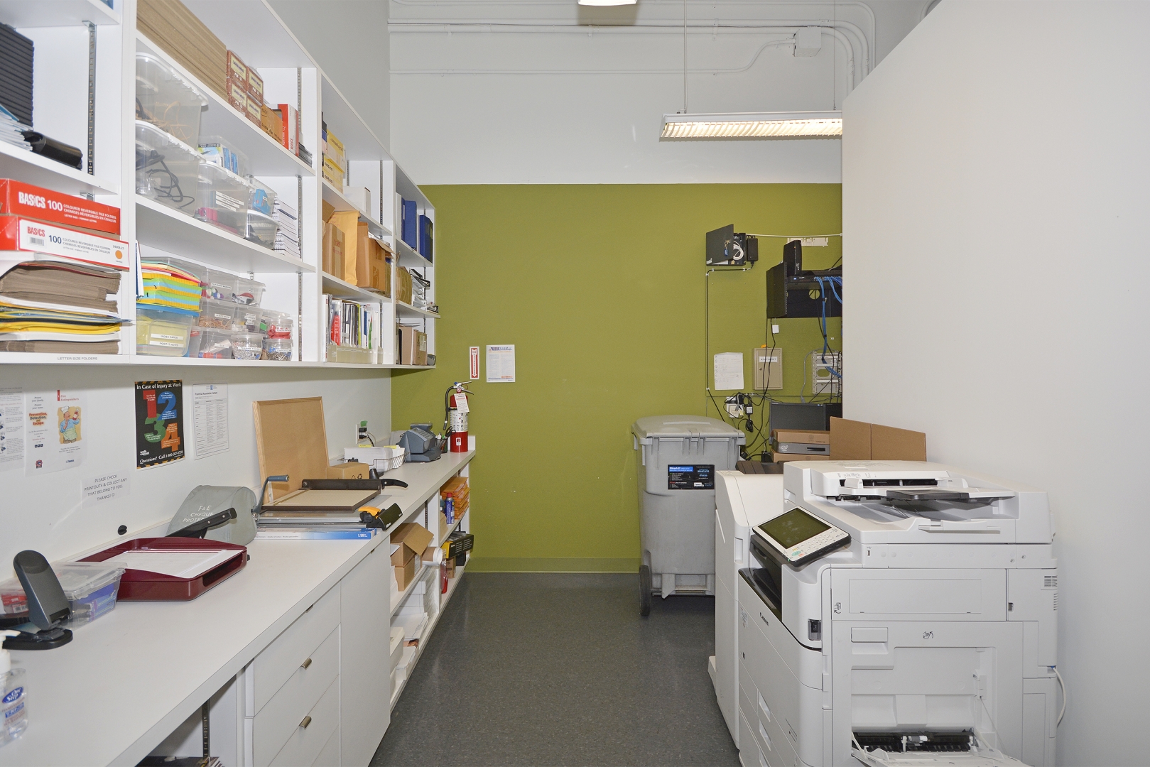 188 Spadina Avenue printing room with stationary on the shelves and printer 