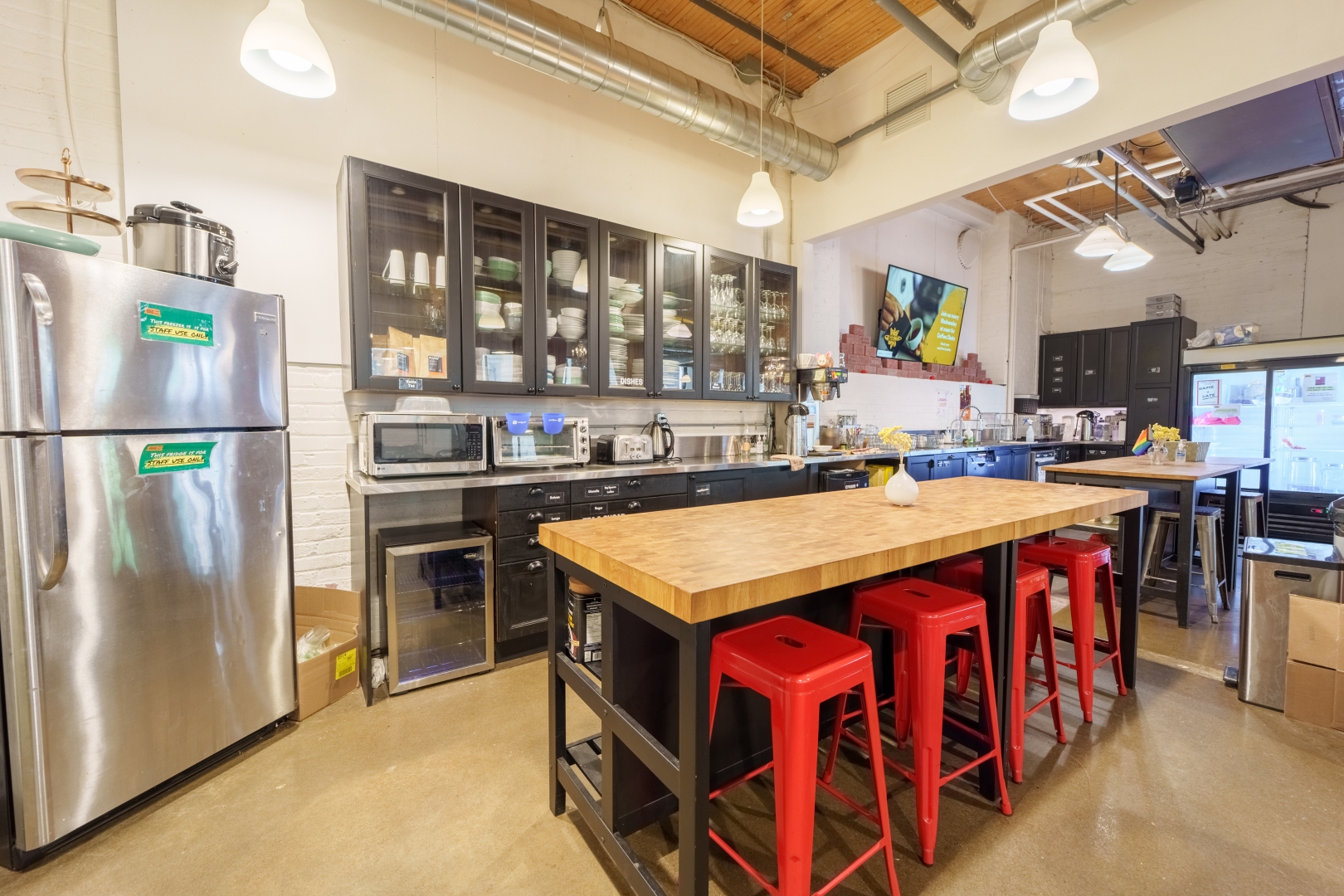 192 Spadina Avenue Community Kitchen with fridge and open table on Main Floor