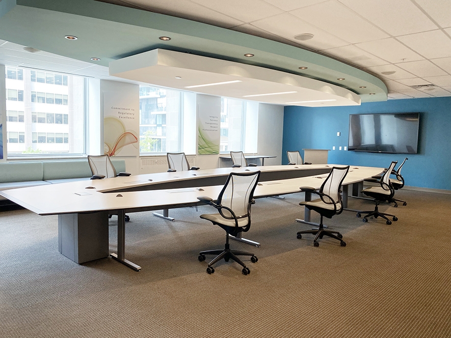 375 University boardroom with TV on the walls and lots of big windows
