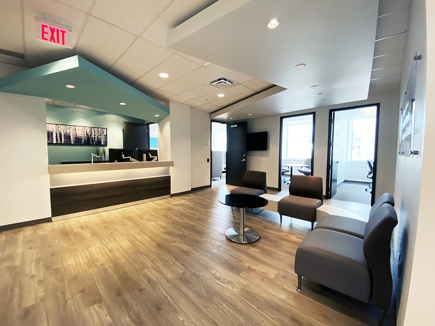 375 University front reception desk with cyan painted wall