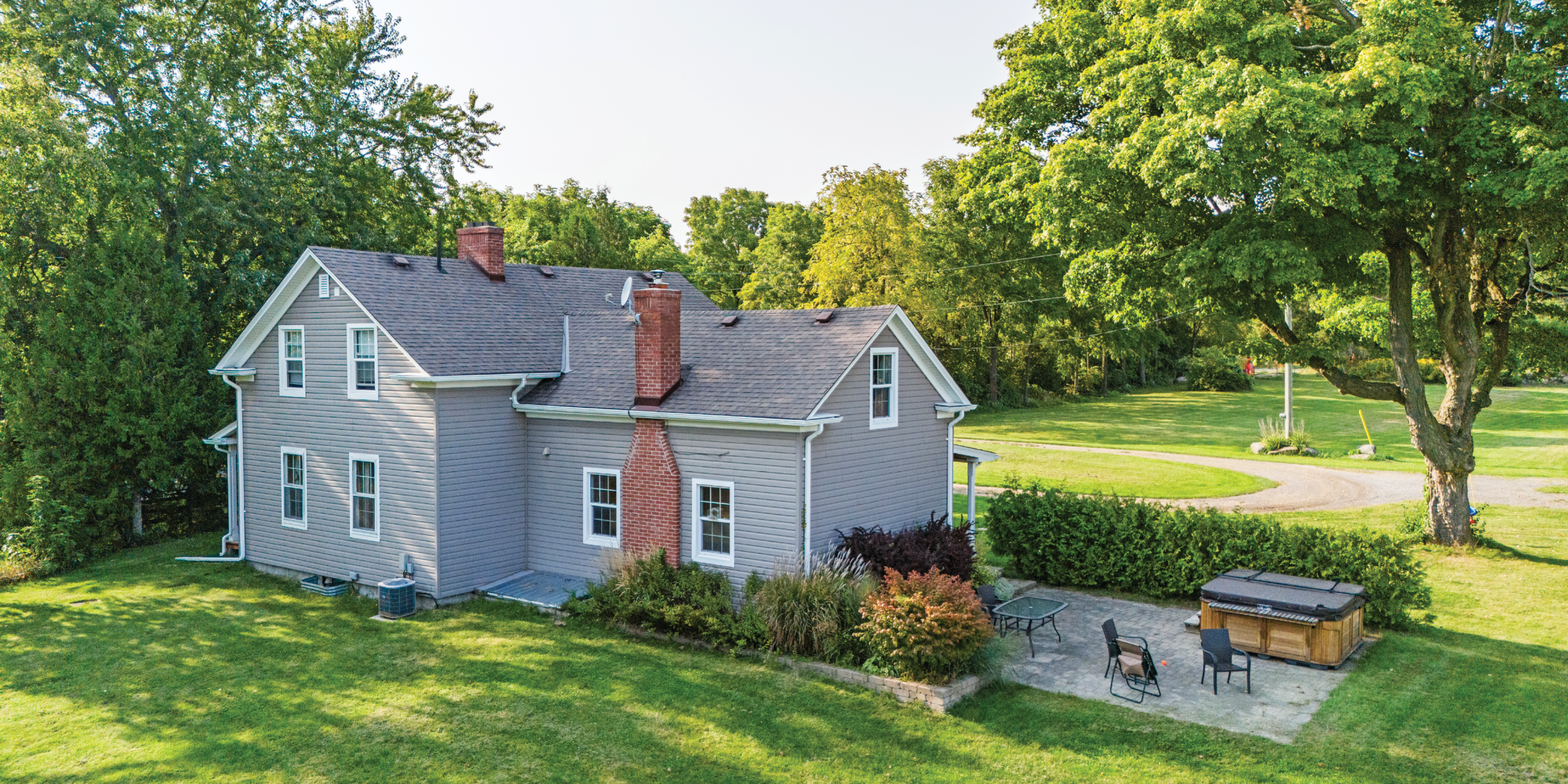 7801 Cochrane Street Homestead with large surrounding trees