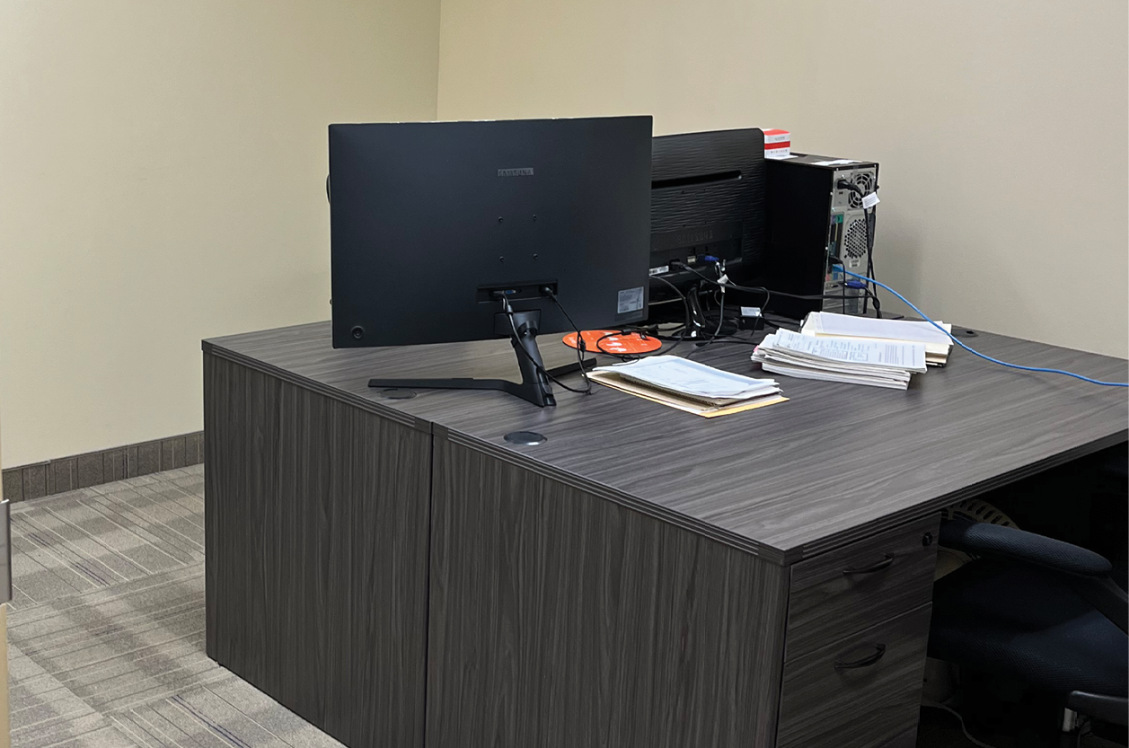 90 Eglinton Avenue E black desk with monitor on it