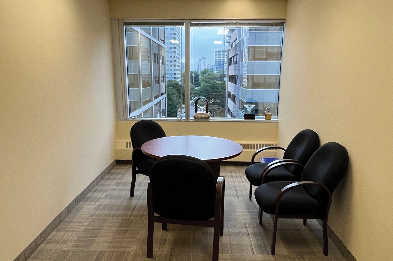 90 Eglinton Avenue E small office room with desk and chairs