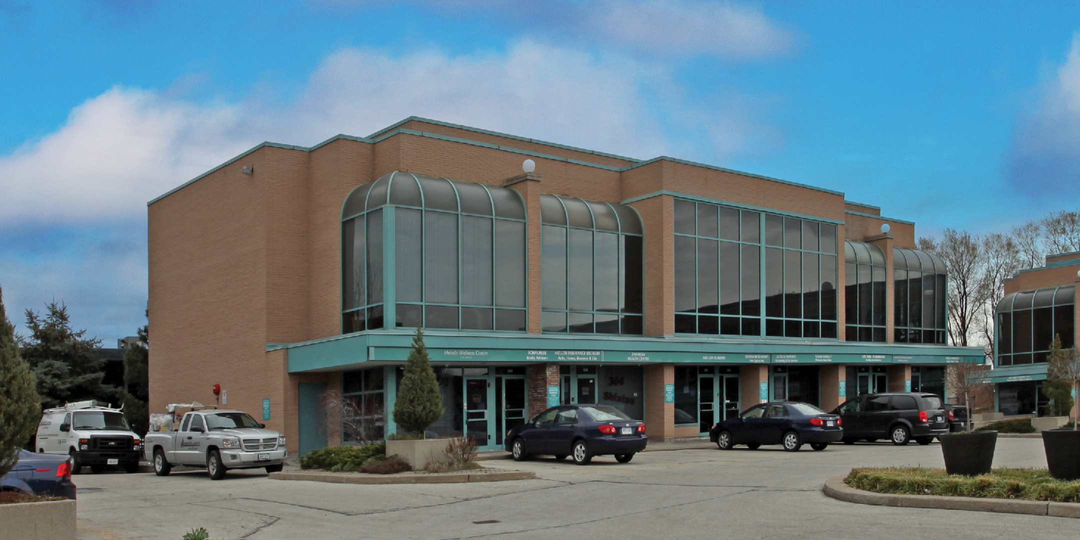  1315 Lawrence building exterior showing parking area