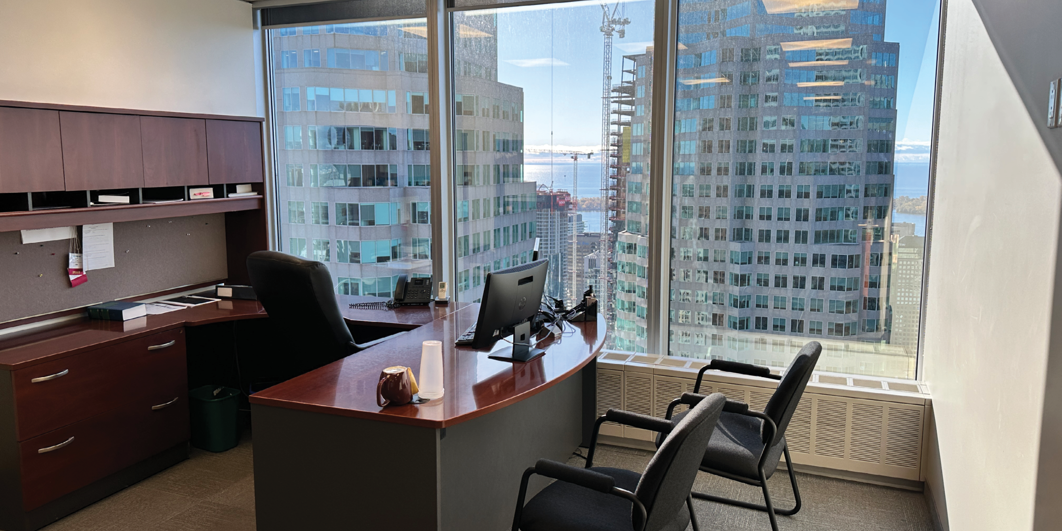199 Bay Street interior view of private office room with large desk and chairs