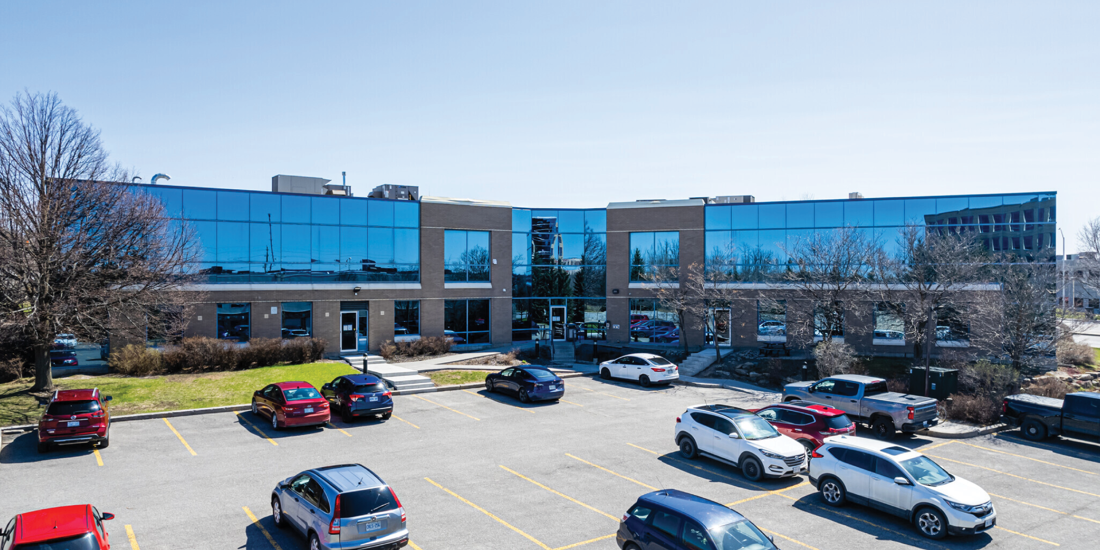 Back view and parking lot of 308 Palladium Drive