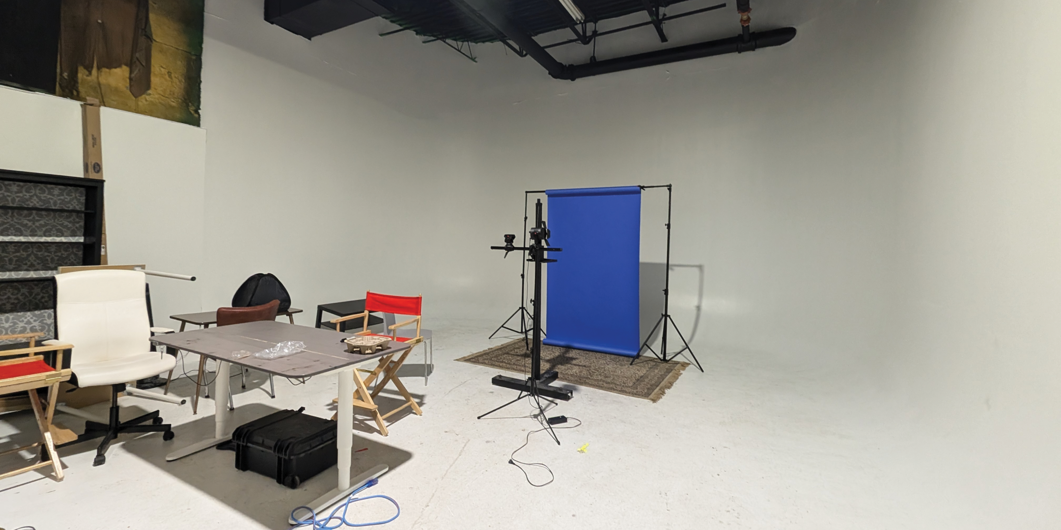 793 Pharmacy Avenue Green Screen Film Area with white walls and desks