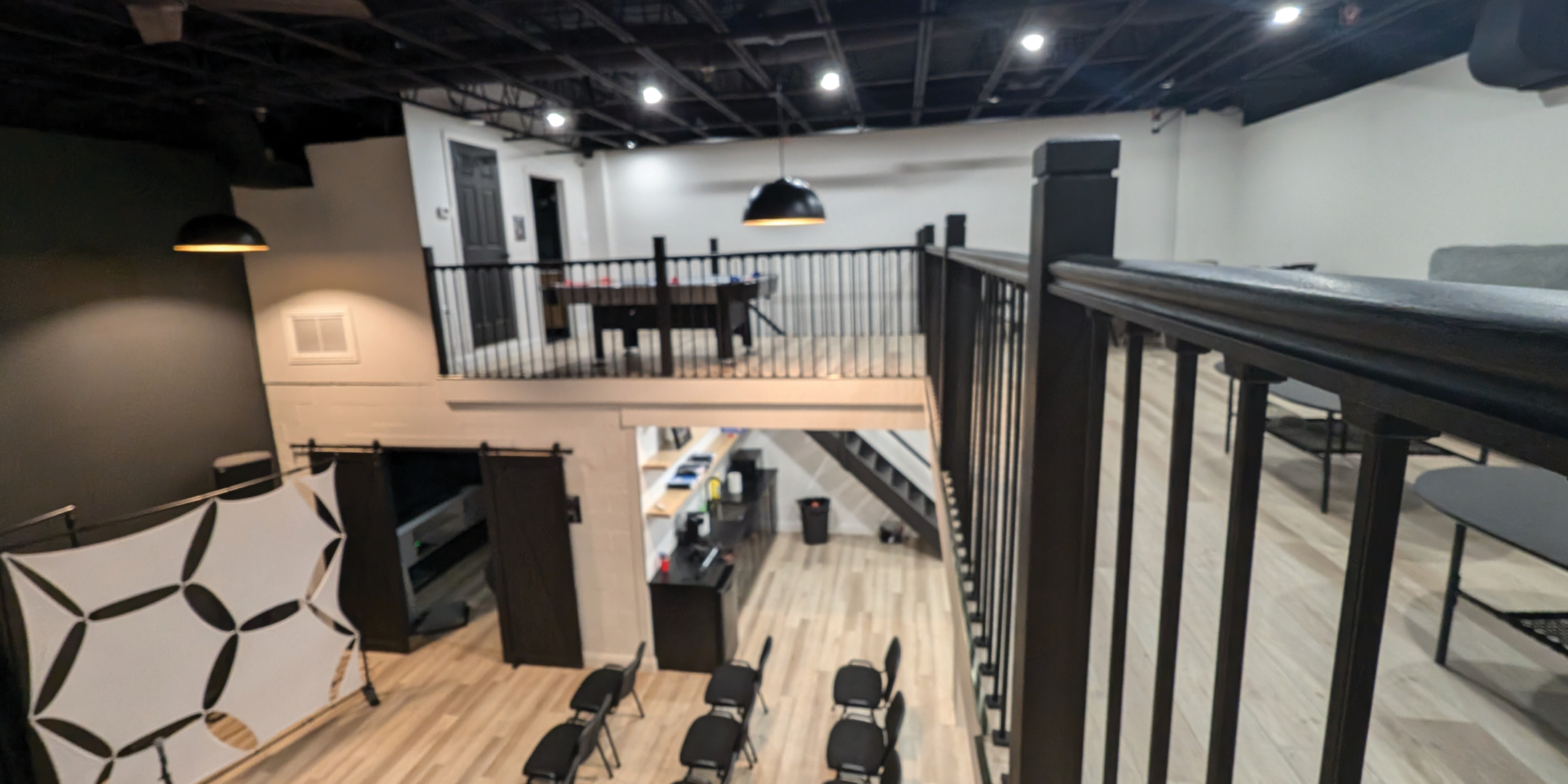 793 Pharmacy Avenue Theatre Area with chairs on upper level 