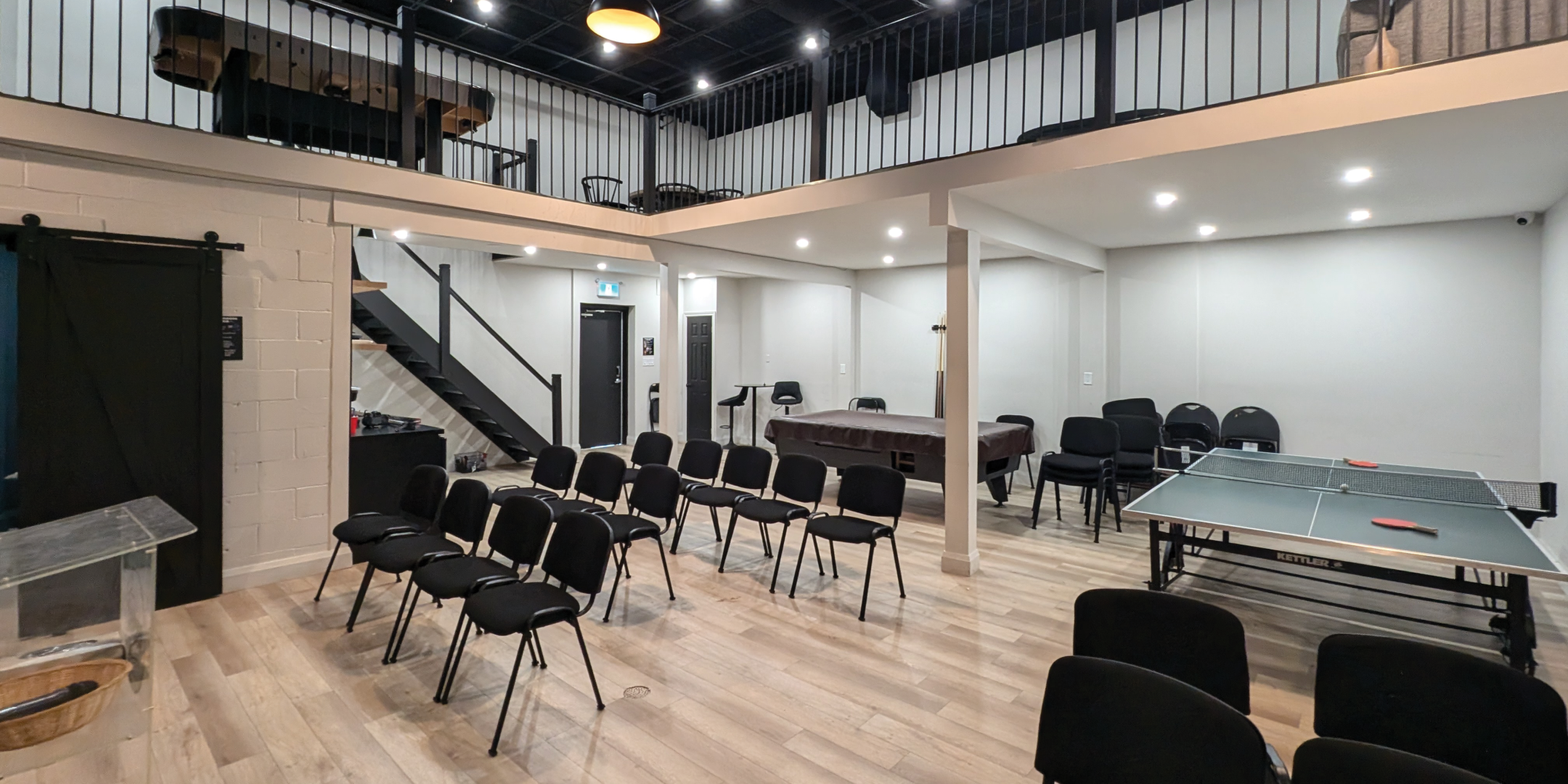793 Pharmacy Avenue Theatre Area with chairs on lower level