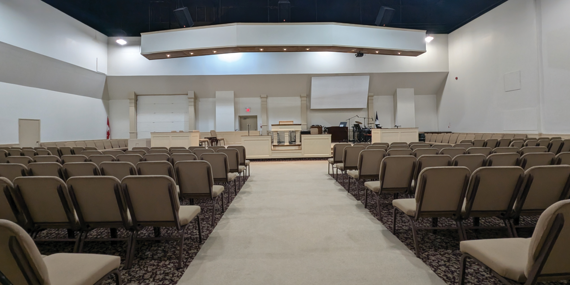 793 Pharmacy Avenue Theatre Area with chairs and projector screen