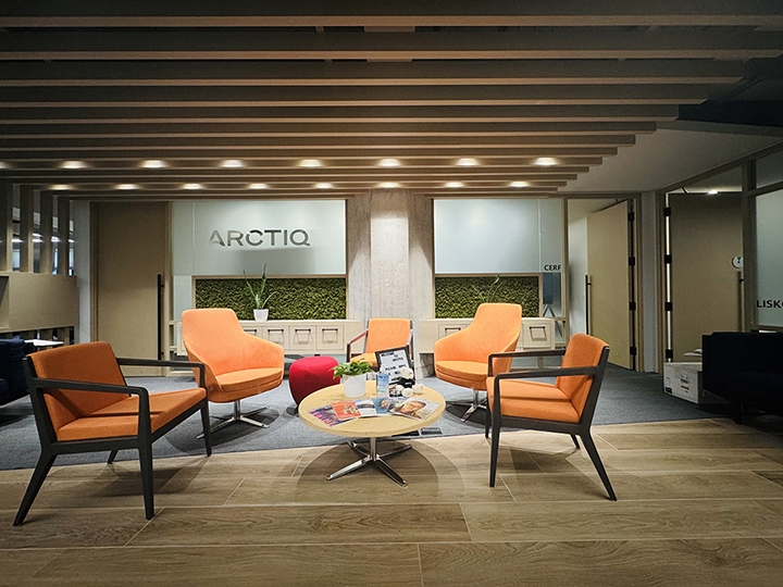 80 Richmond St W interior view with orange chairs and a coffee table