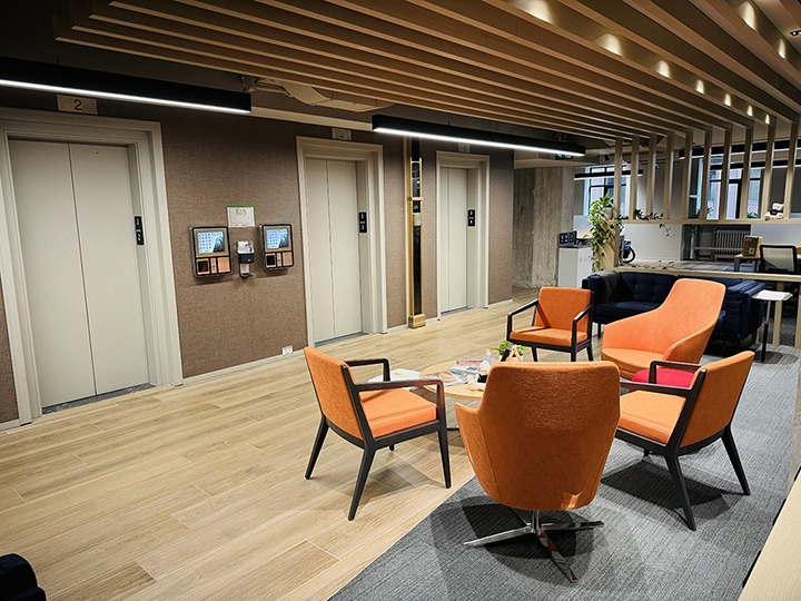 80 Richmond St W interior view with elevators and some chairs