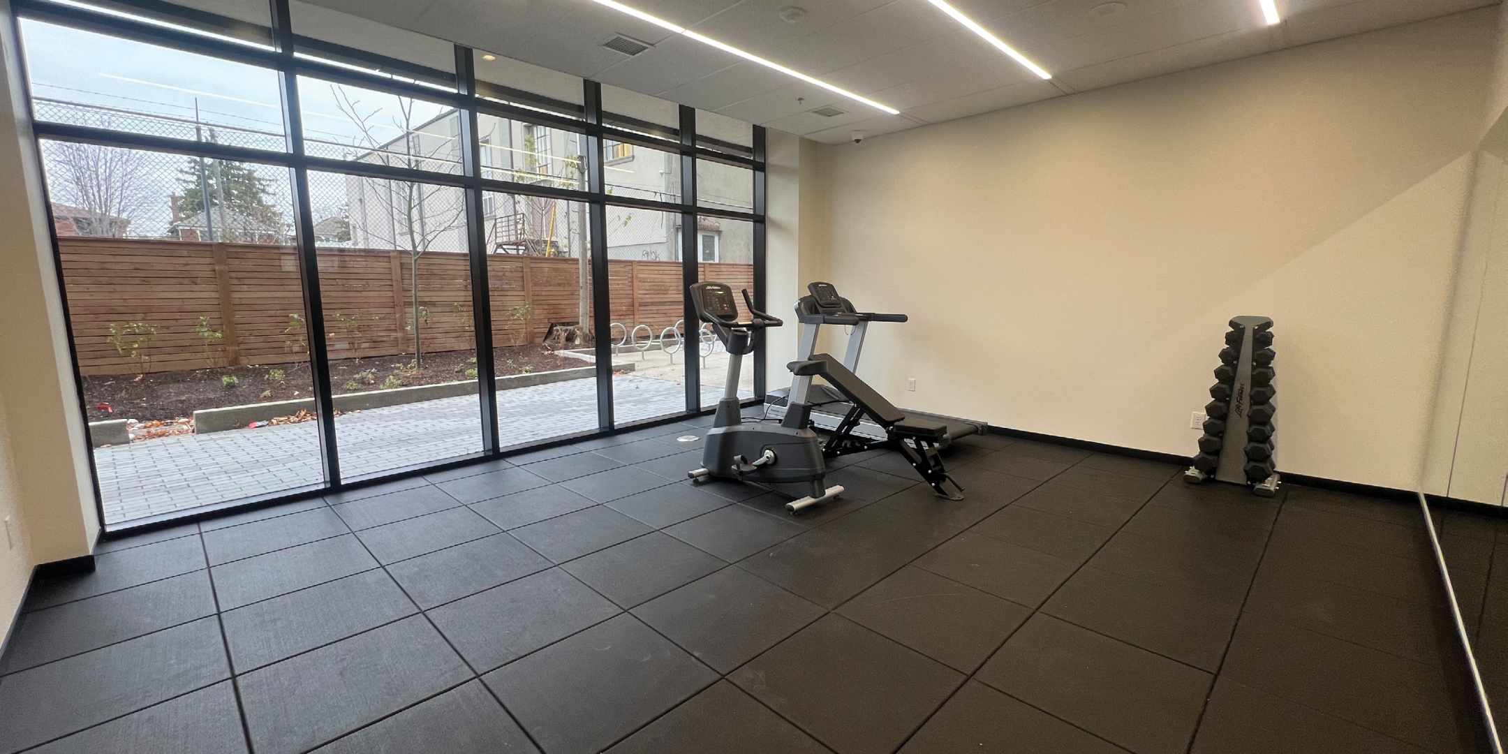300 Geary gym with equipment and big windows
