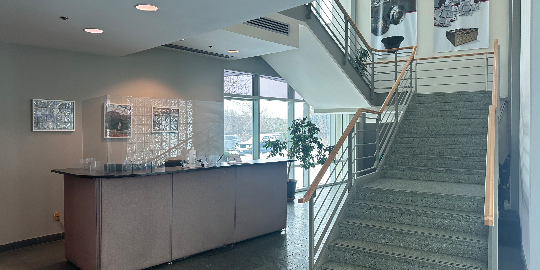51 Four Valley Drive Front Reception Area with desk and staircase to upper level