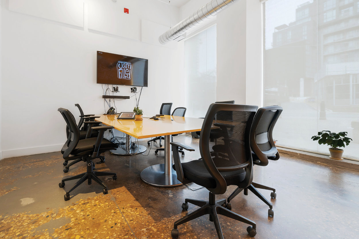 571 Adelaide Street E ground floor boardroom with mounted TV
