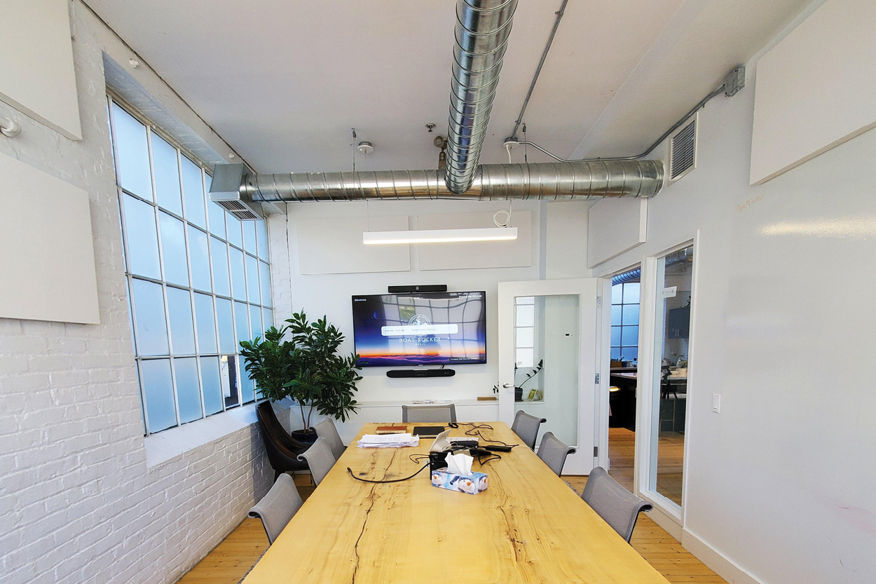 571 Adelaide Street E second floor boardroom with mounted TV