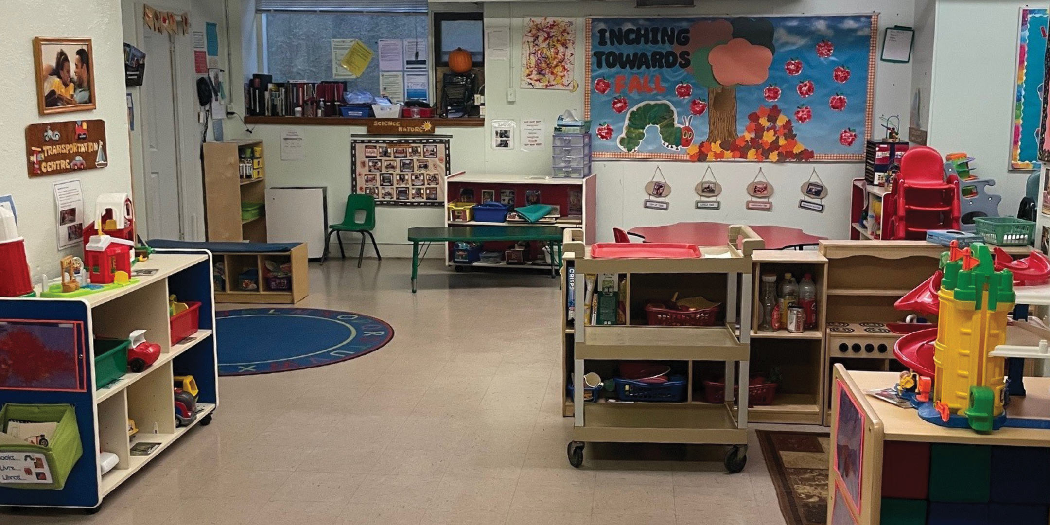 611 St. Clair Avenue W interior view of classroom with low shelves holding toys, books, and art supplies