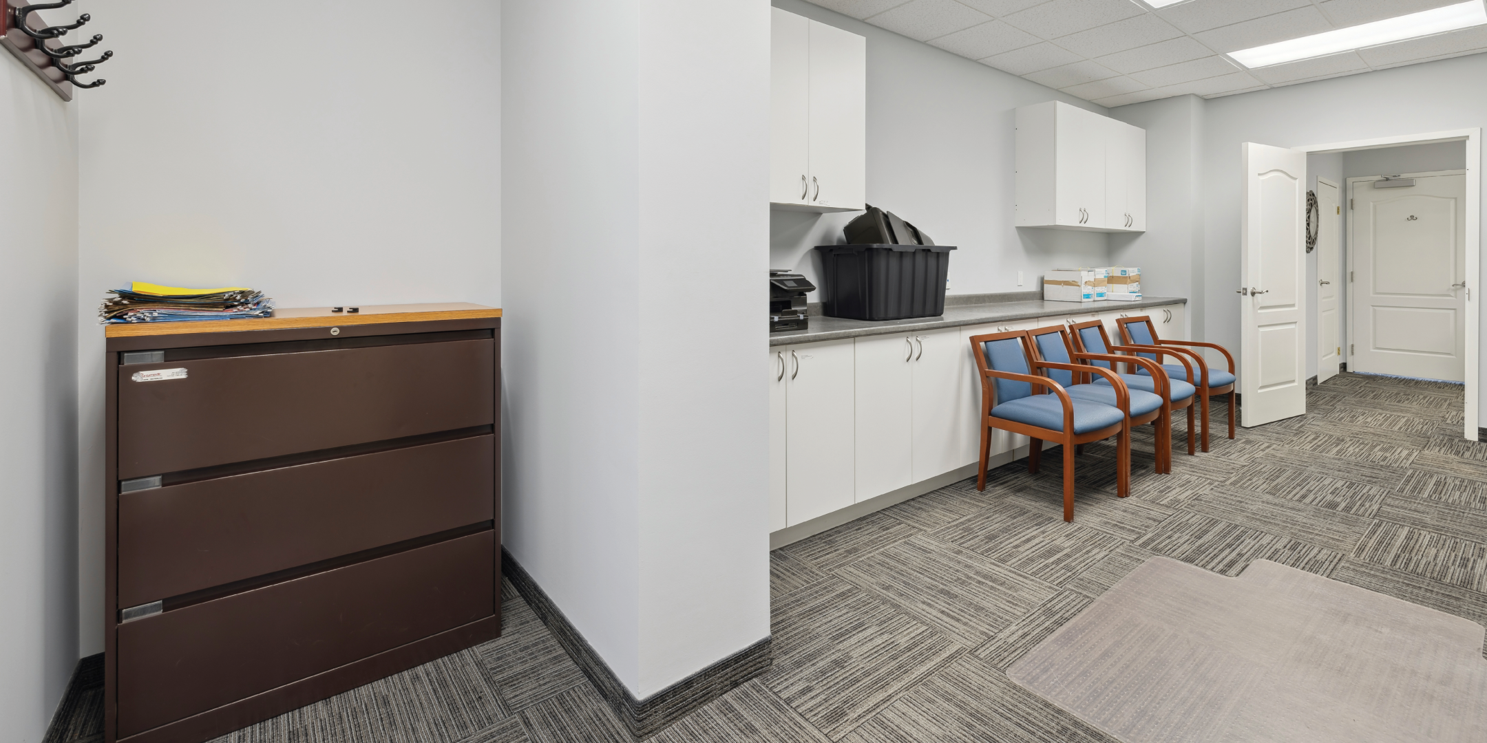 Interior room with storage cabinets and seating