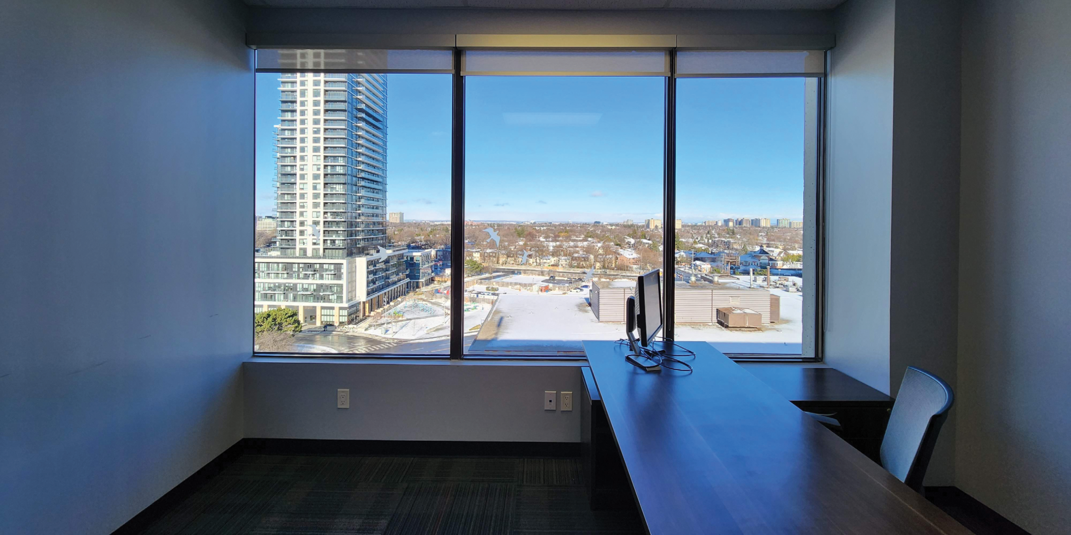 200 Consumers Road private office with hugh window overlooking the desk and chair