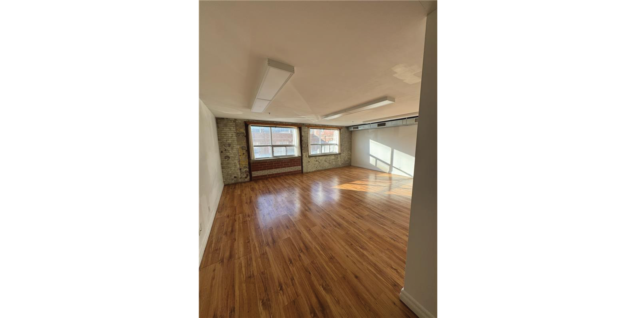 5 Adrian Avenue Interior Open Retail Space with hardwood floors and windows