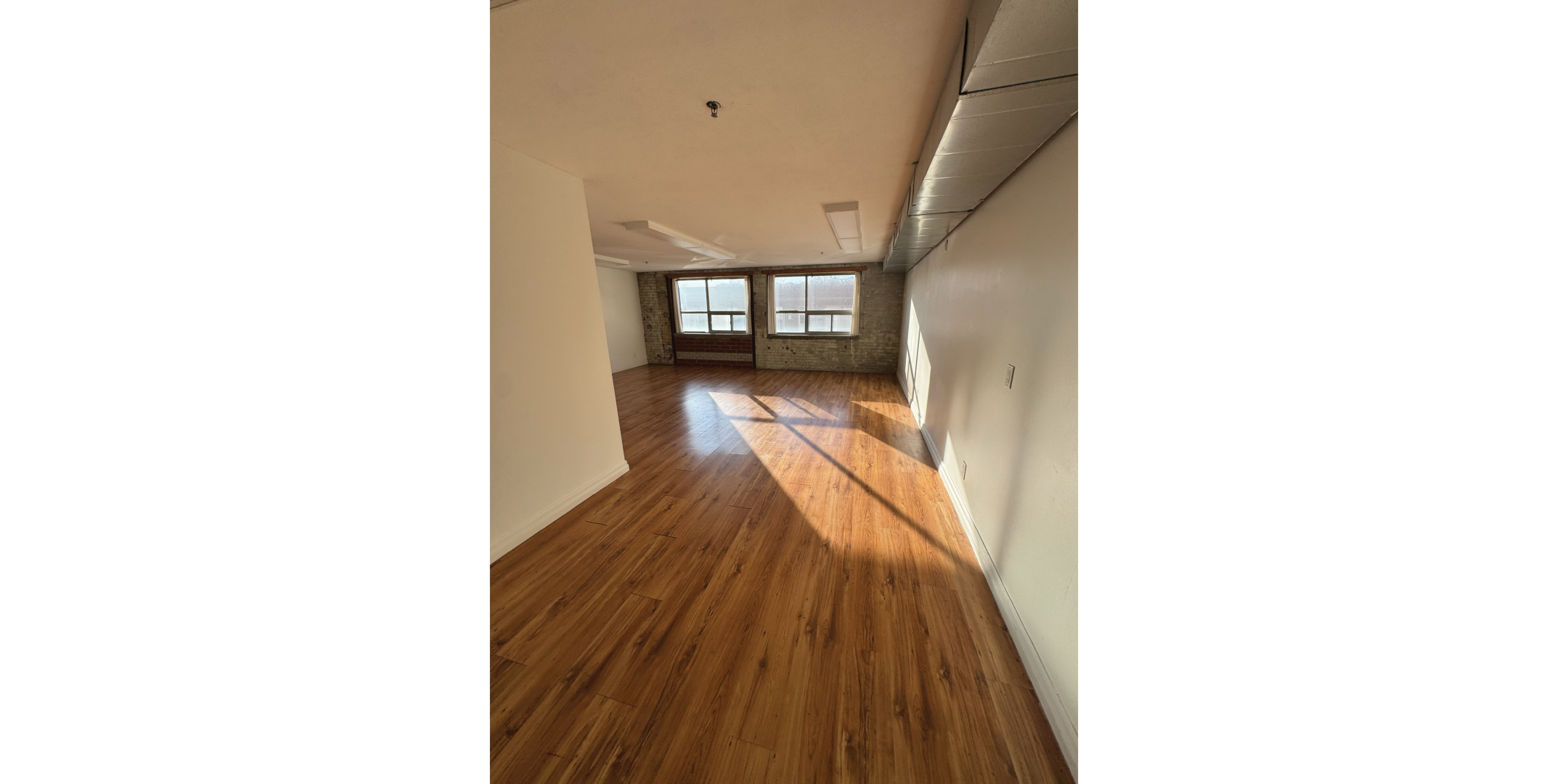 5 Adrian Avenue Interior Open Retail Space with hardwood floors and windows