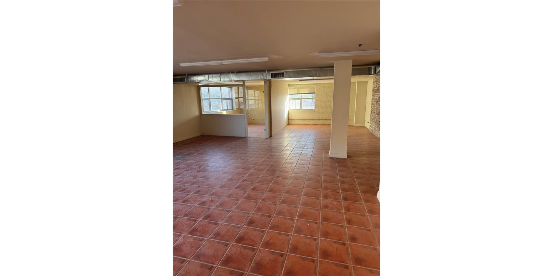 5 Adrian Avenue Interior Open Retail Area with brown tile flooring